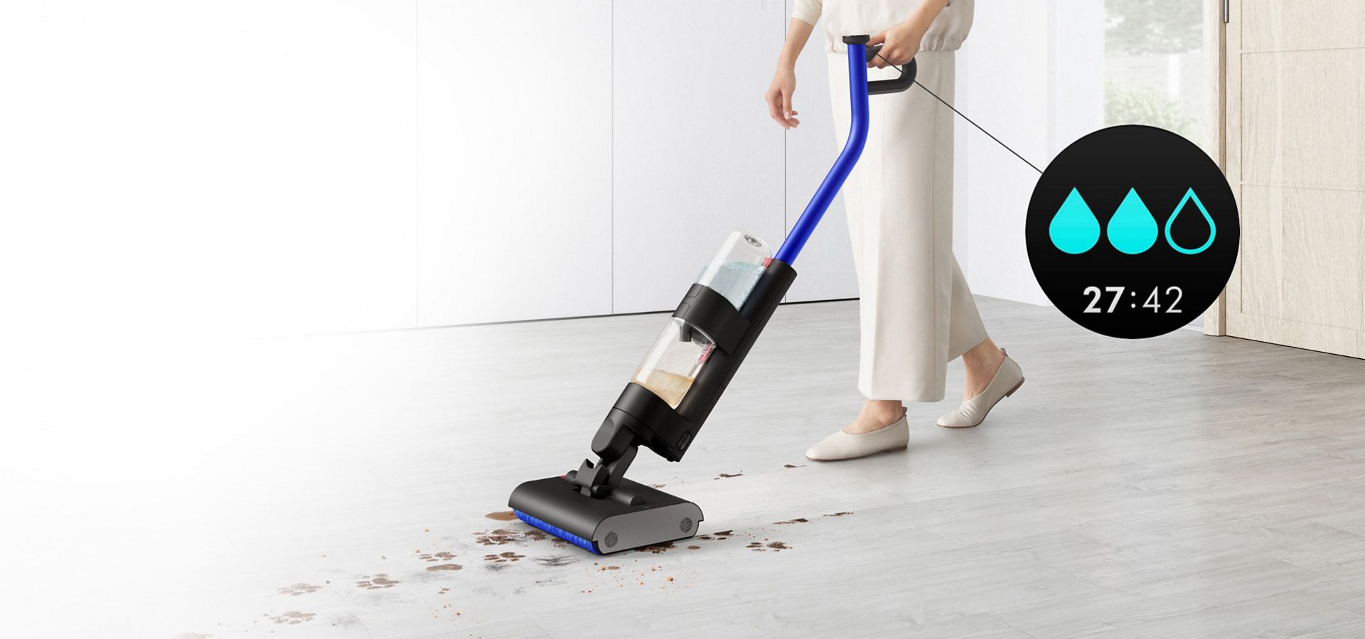 A user cleaning a hard floor in a living area, and a Max icon indicating the machine's hydration mode