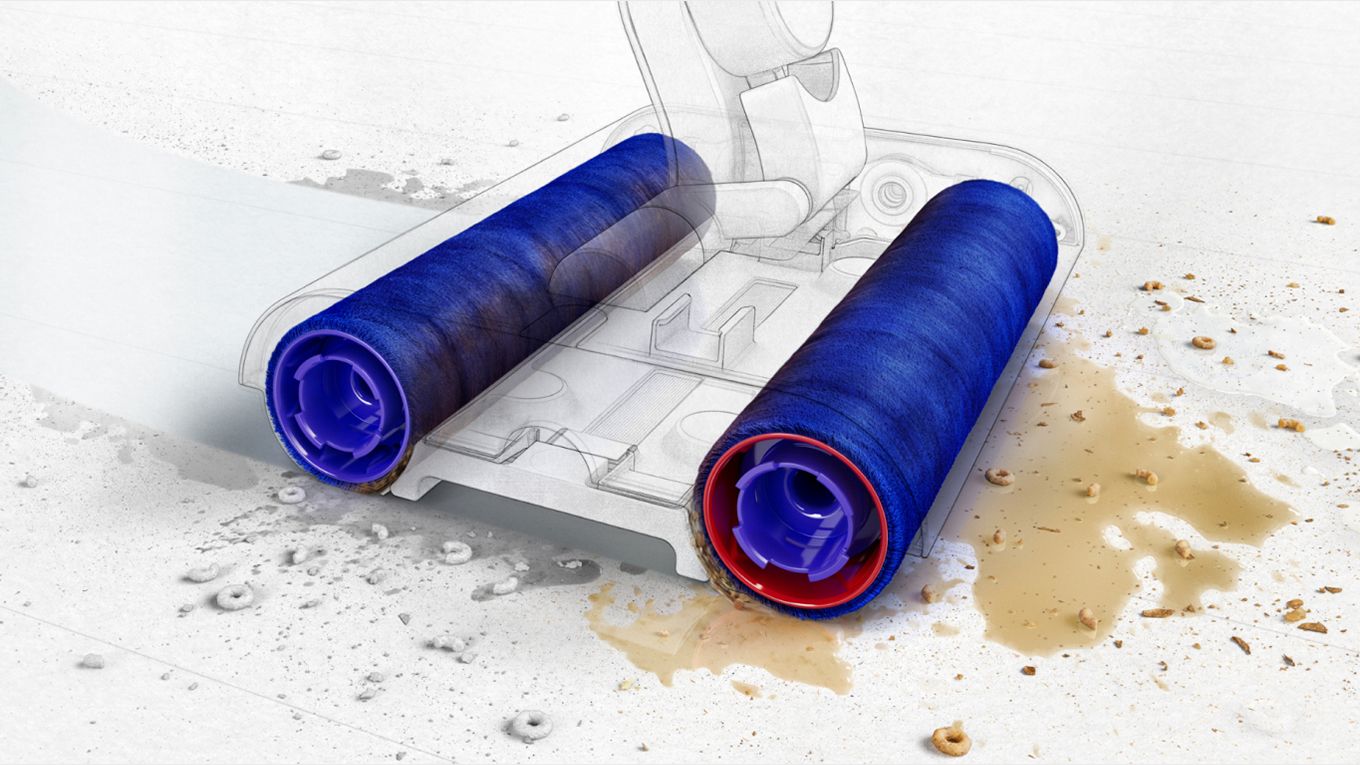 De tettpakkede mikrofiberrullene fjerner poteavtrykkene etter kjæledyr fra et hardt gulv De tettpakkede mikrofiberrullene fjerner poteavtrykkene etter kjæledyr fra et hardt gulv