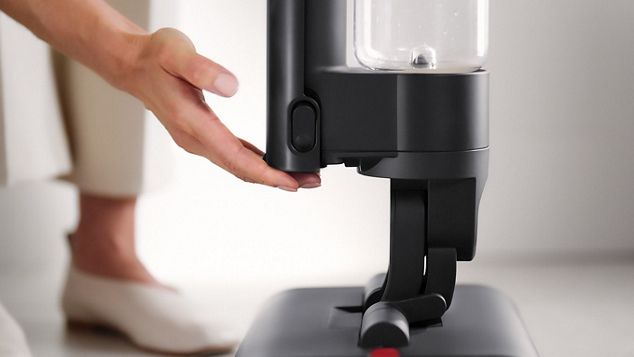 A user's hands attaching a click-in battery
