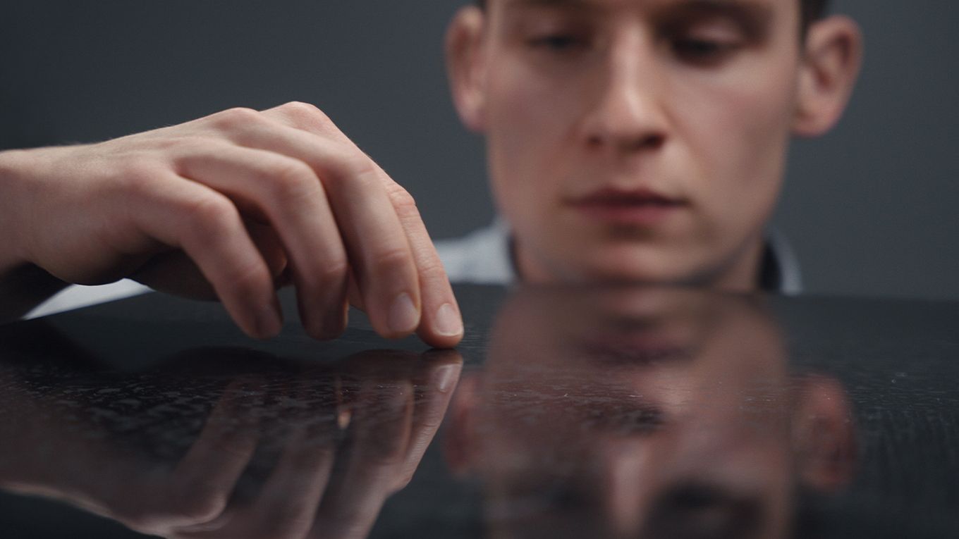 Engineer inspecting a hard surface.