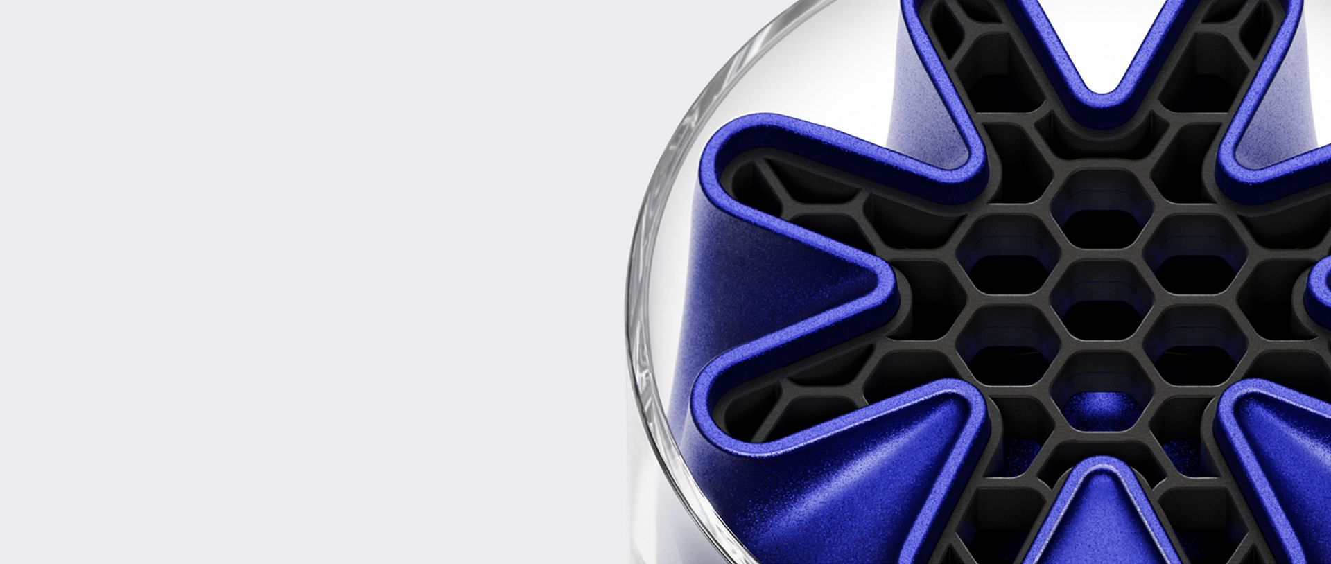 A Dyson HushJet Mini Cool fan tip showing the unique star-shaped HushJet nozzle in blue.