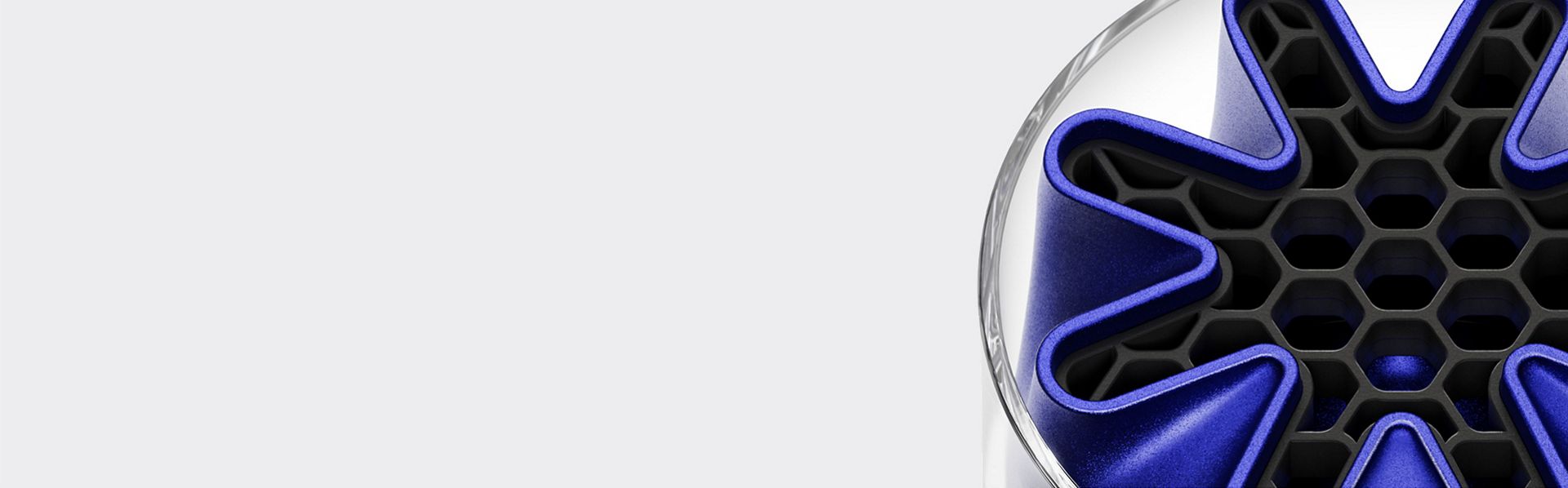 A Dyson HushJet Mini Cool fan tip showing the unique star-shaped HushJet nozzle in blue.
