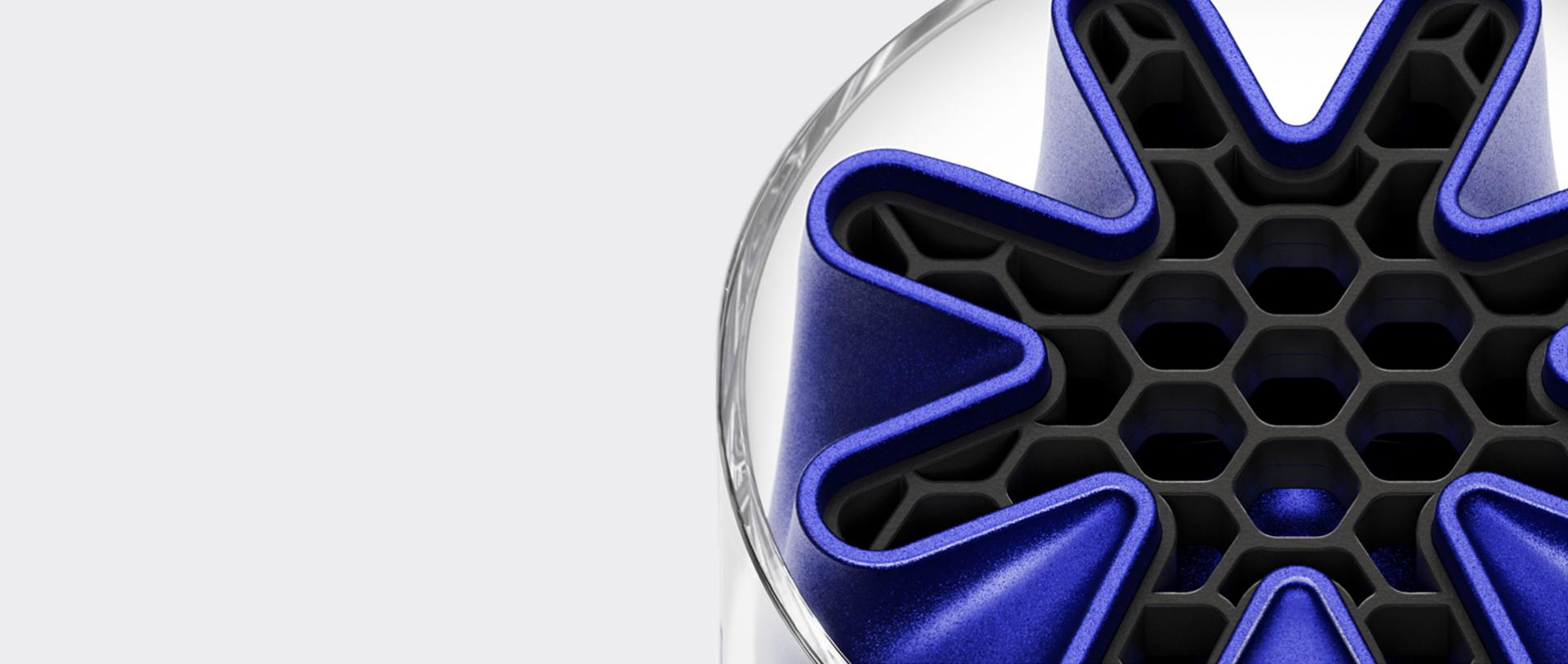 A Dyson HushJet Mini Cool fan tip showing the unique star-shaped HushJet nozzle in blue.