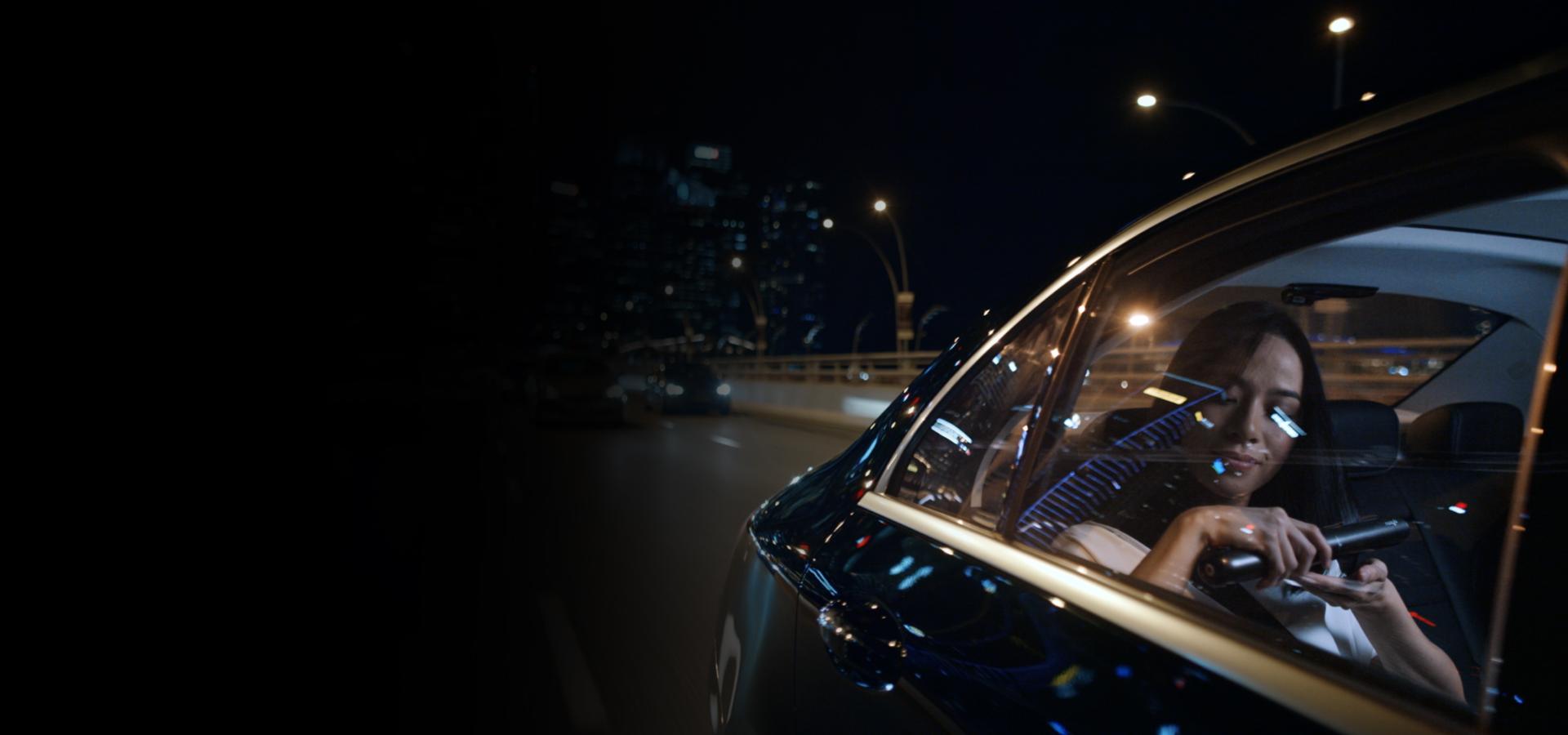 Woman straightening her hair with the Dyson Corrale straightener