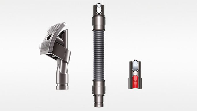 Dyson Hair screw tool sucking up hair in a pet bed