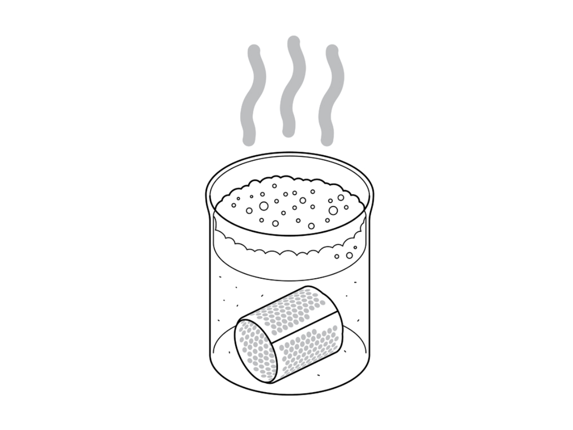 Dyson Supersonic filter soaking in soapy water