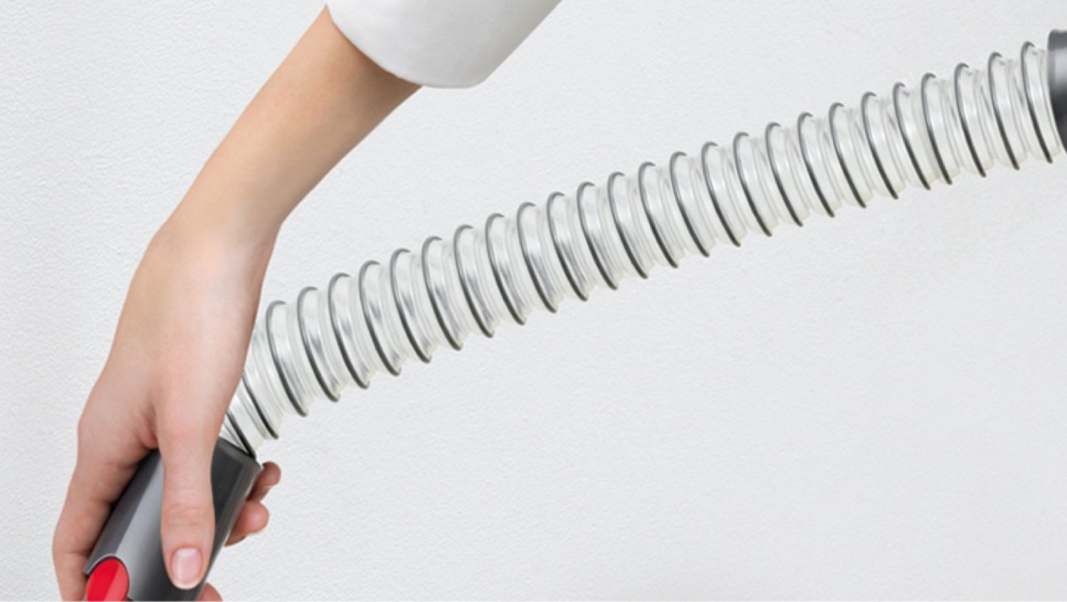 Woman using Extension hose for flexible reach