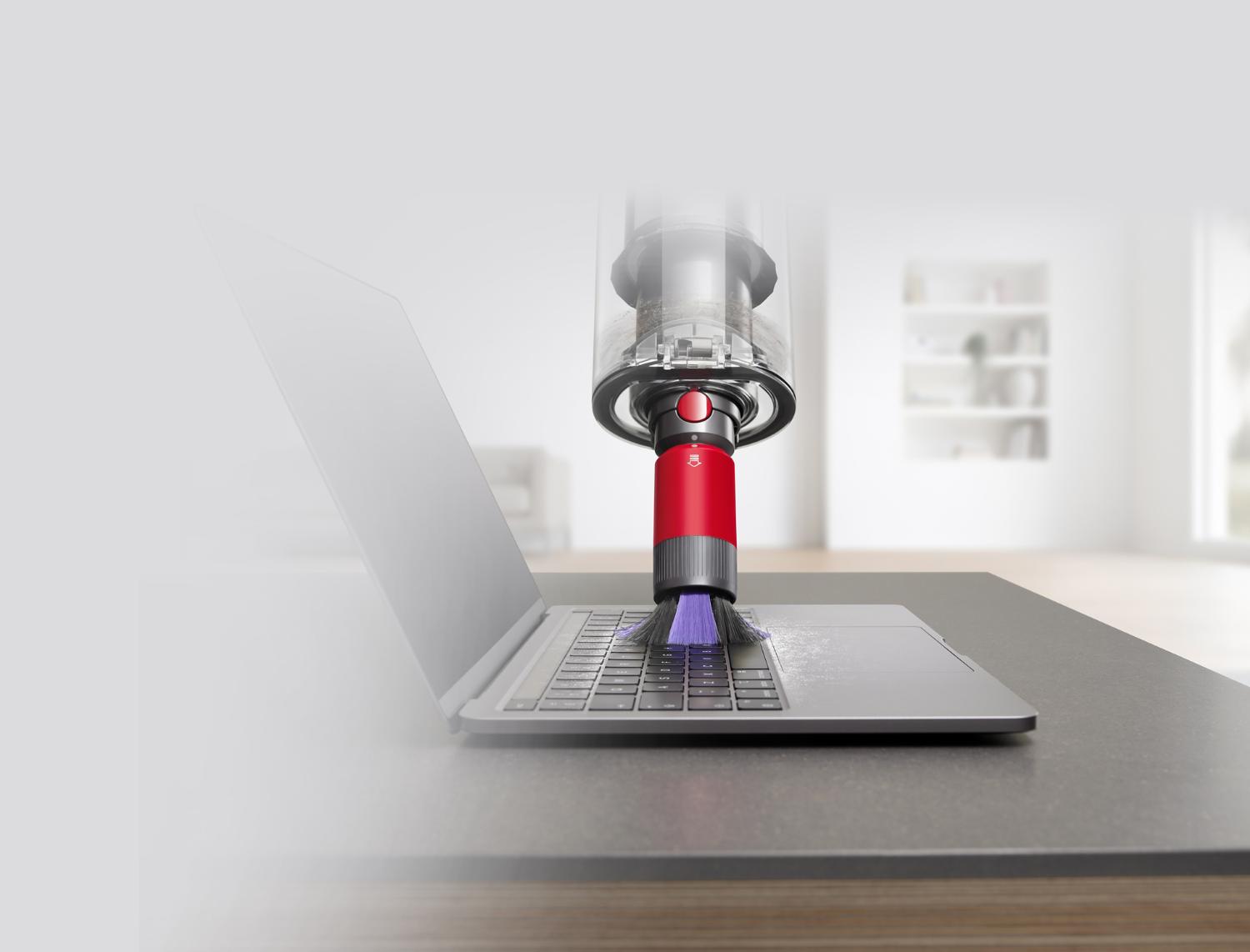 Scratch-free dusting brush cleaning a laptop