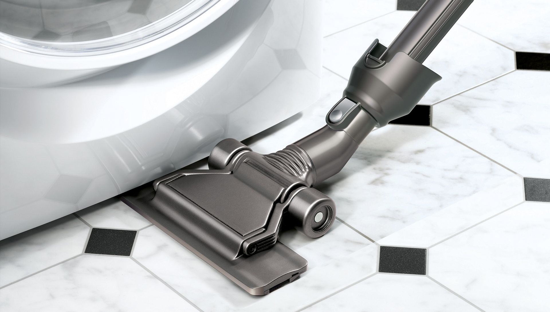 Flat out floor tool being used to clean in awkward, hard to reach places.