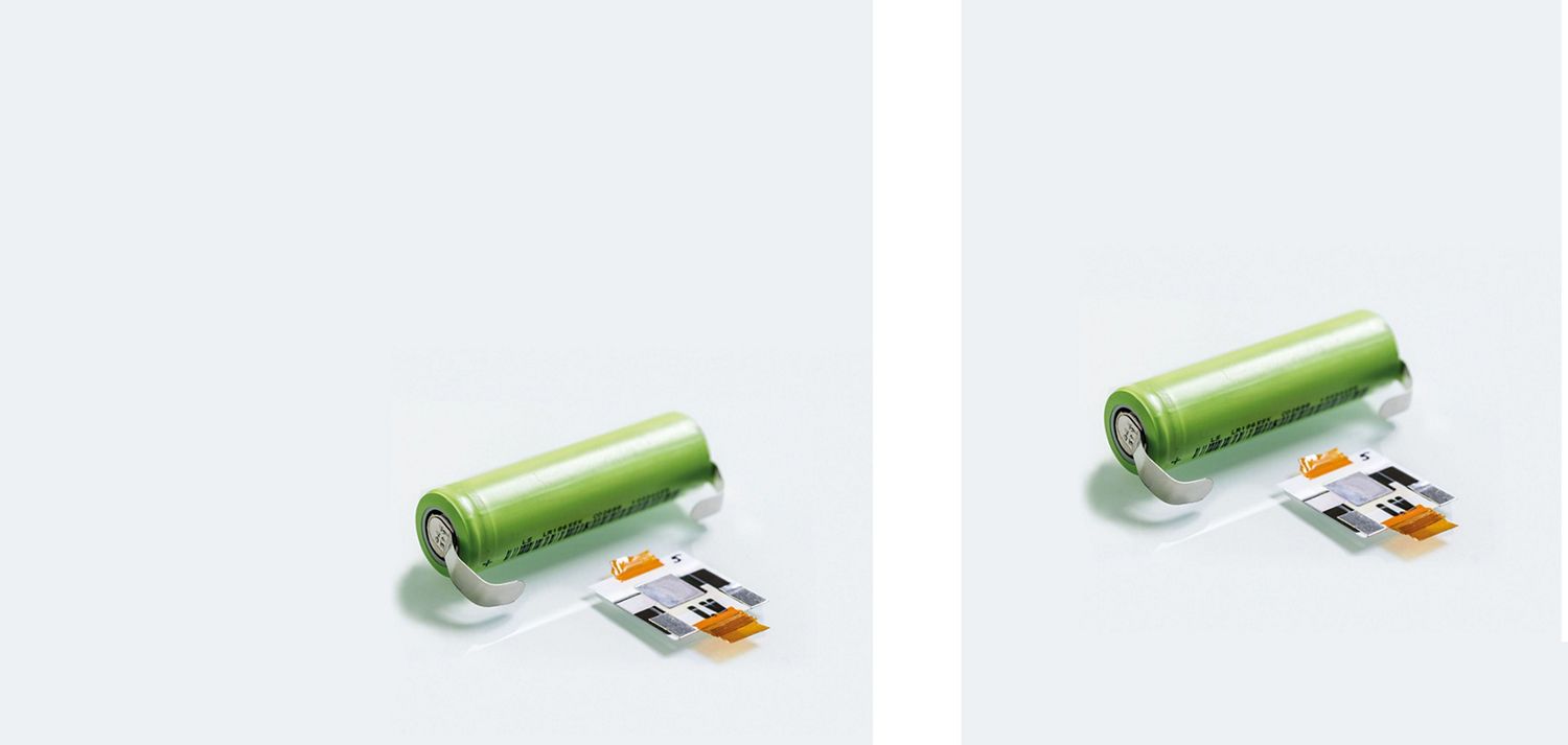 Battery cells next to a battery shell. Battery cells next to a battery shell.