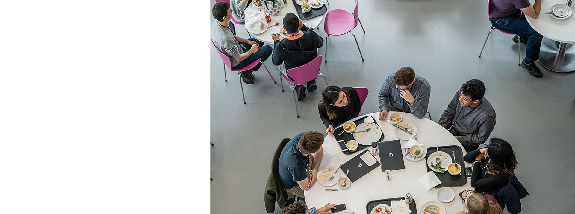  Dyson employees eating in a Dyson café.