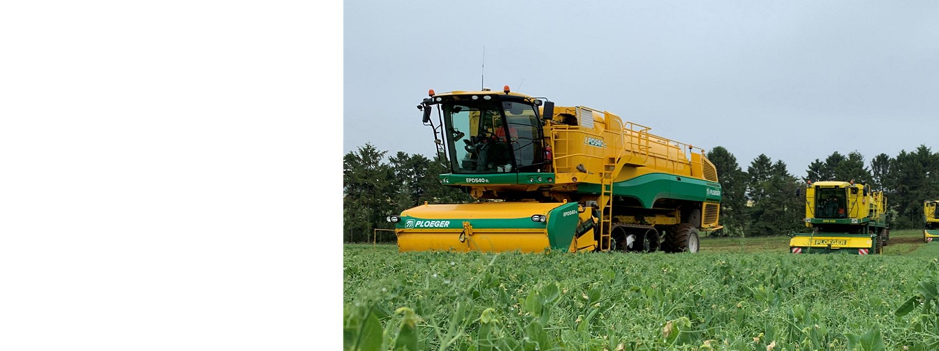 Combine harvester harvesting crops on a Dyson farming site.