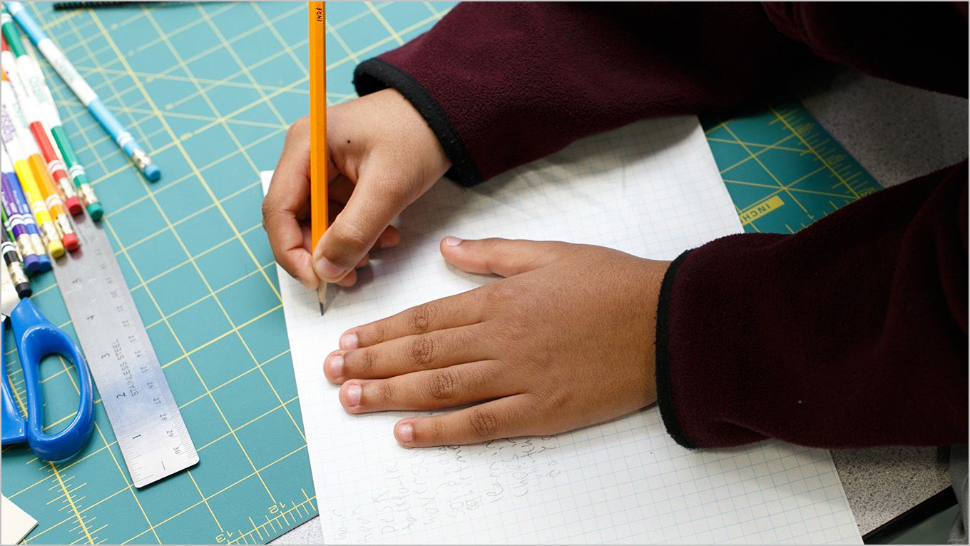 A student sketching out an engineering concept. A student sketching out an engineering concept.