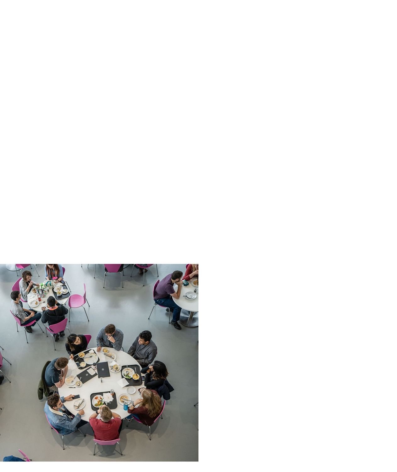  Dyson employees eating in a Dyson café.