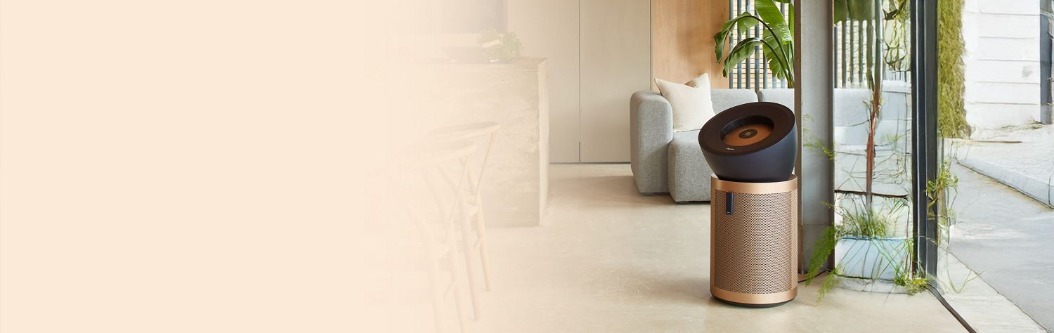 Dyson Purifier Big+Quiet Formaldehyde in a large room in front of a circular staircase.