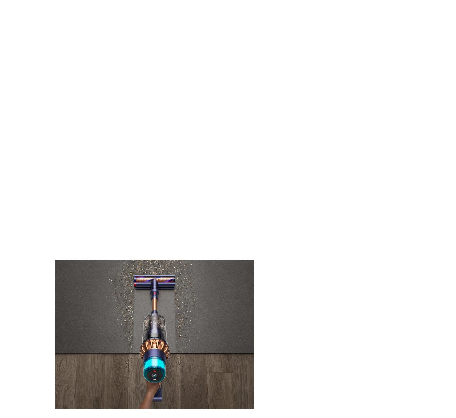 Dyson vacuum vacuuming hardwood floor and carpet