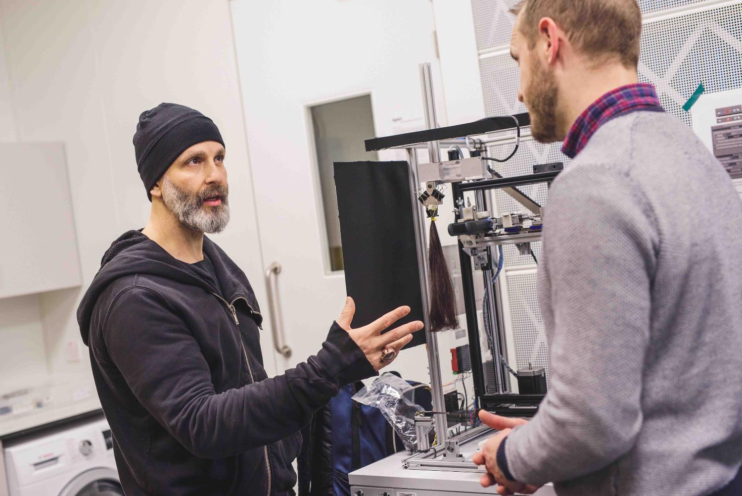 Dyson Global Ambassador Jon Reyman speaks with a Dyson engineer.