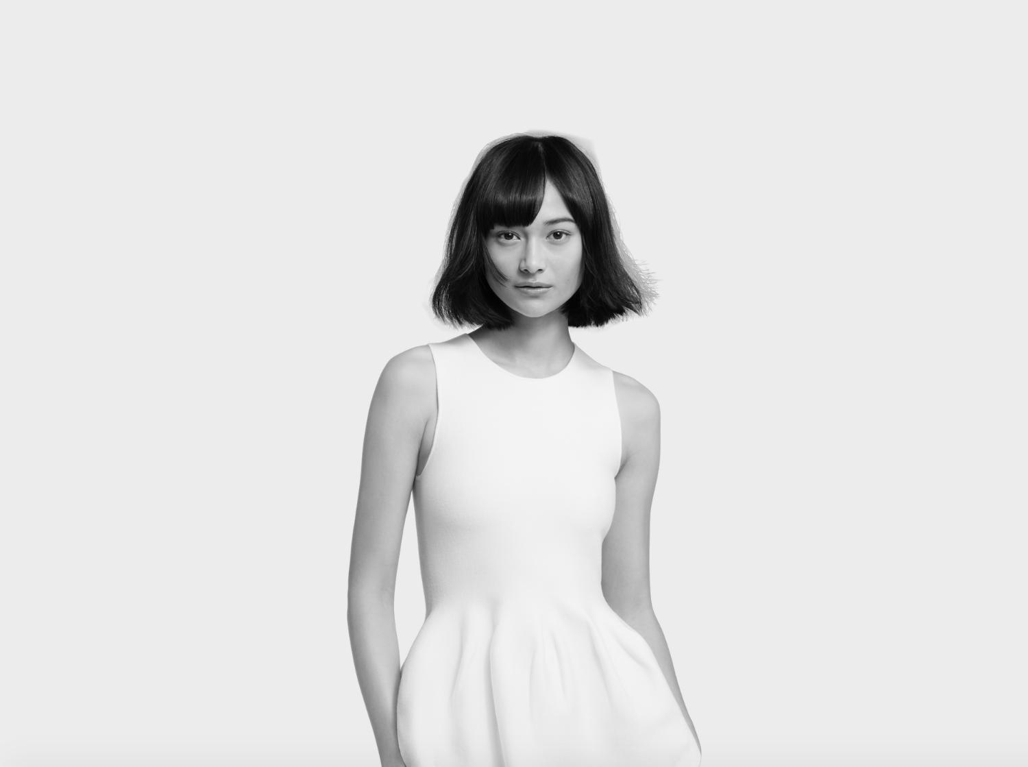 Model with a haircut featuring bangs.