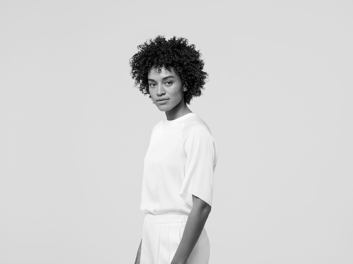 Model with a haircut featuring texture and coils.