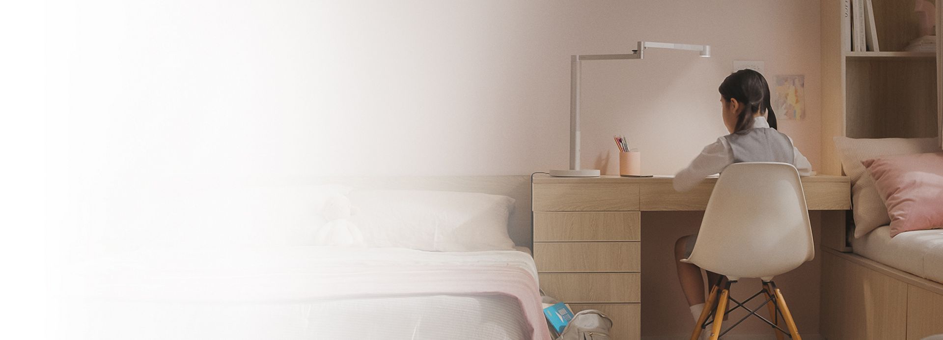 Dyson Solarcycle Morph desk lamp providing light to read by