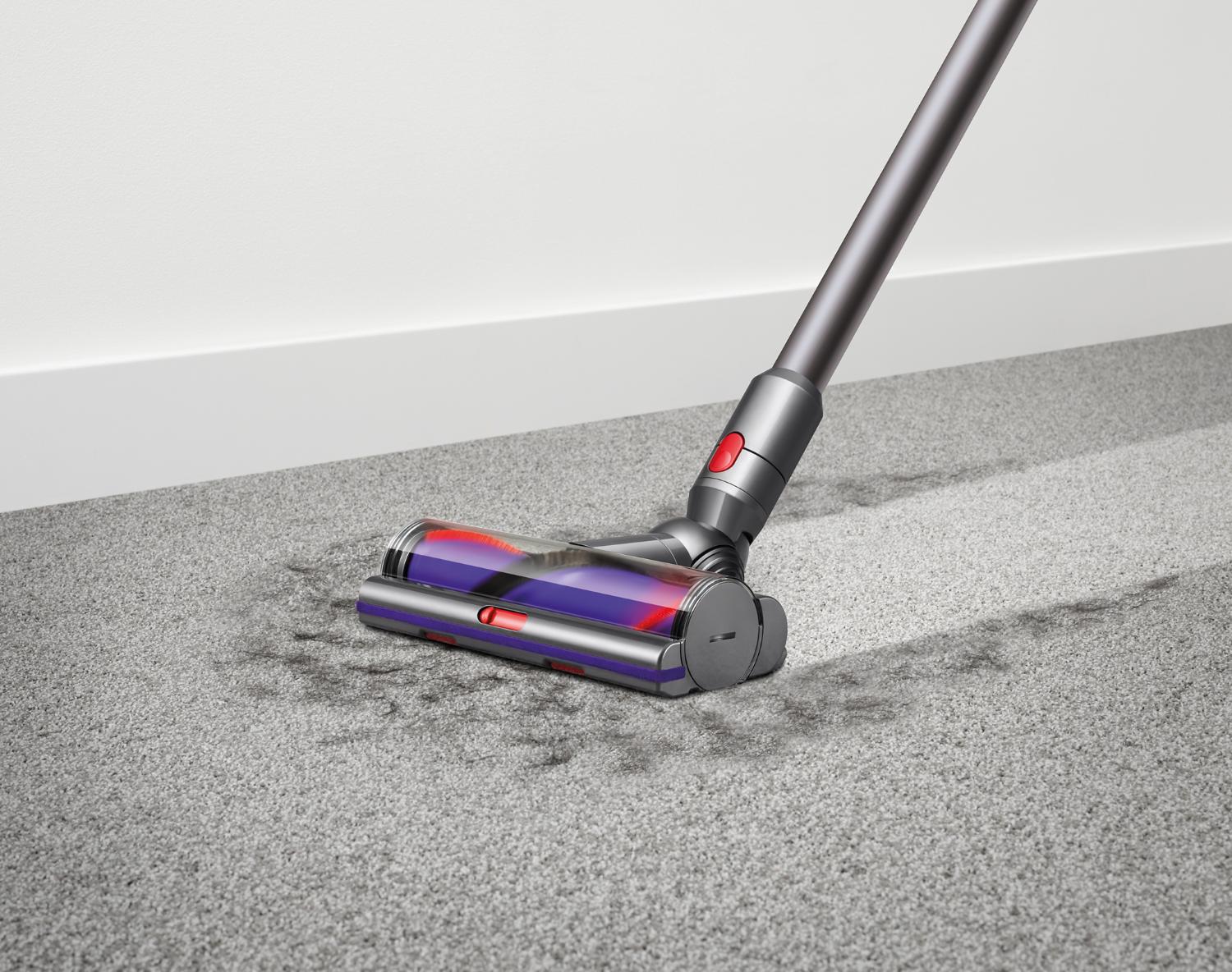 Dyson V10 motorhead vacuuming up fur from carpet