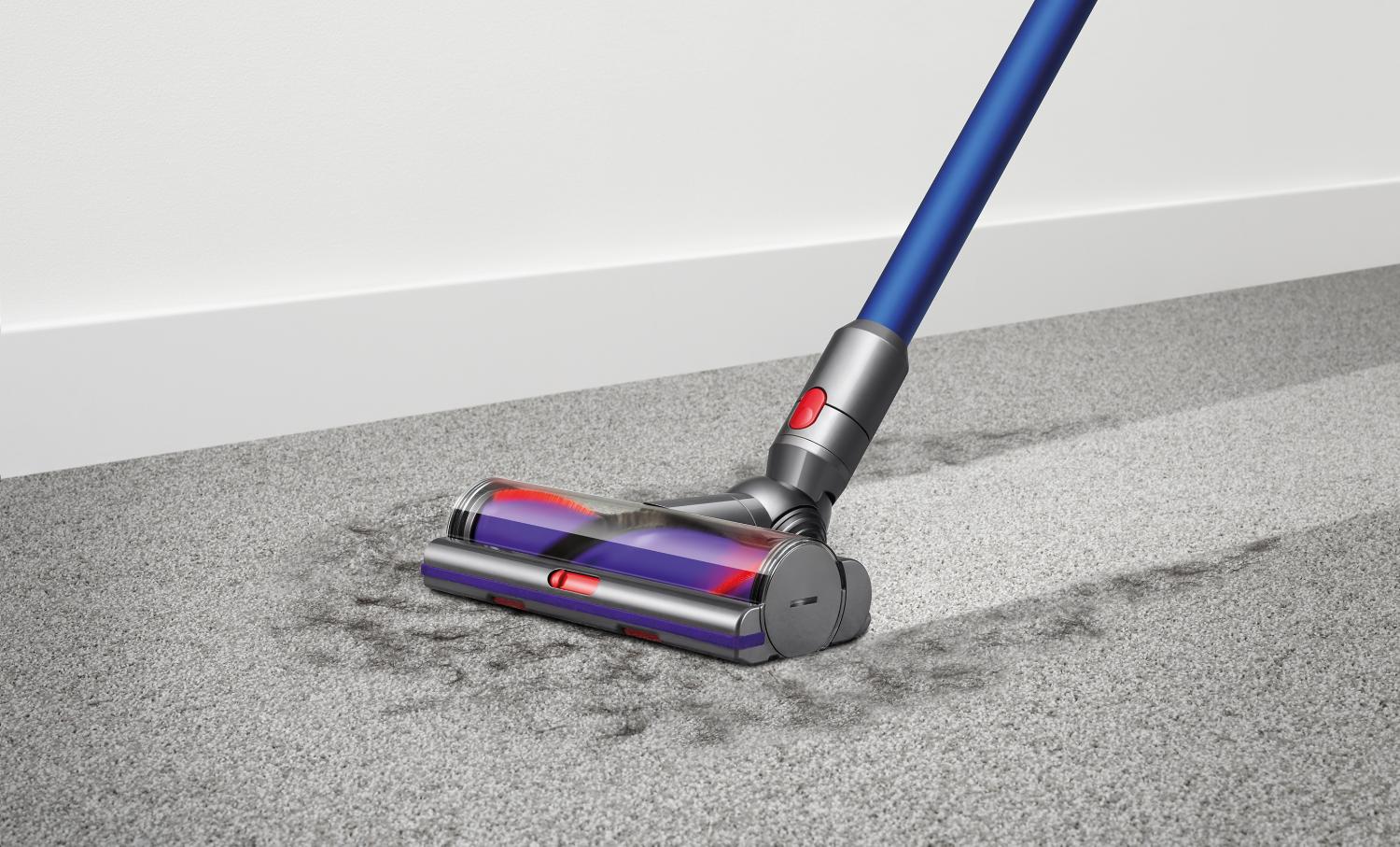 Dyson V10 motorhead vacuuming up fur from carpet