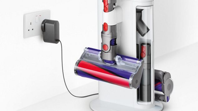 Close-up of Dyson Cyclone V10 Dok™ and wall socket with plug