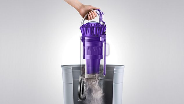 Dyson Ball Animal 2 Pro ejecting dirt into garbage can