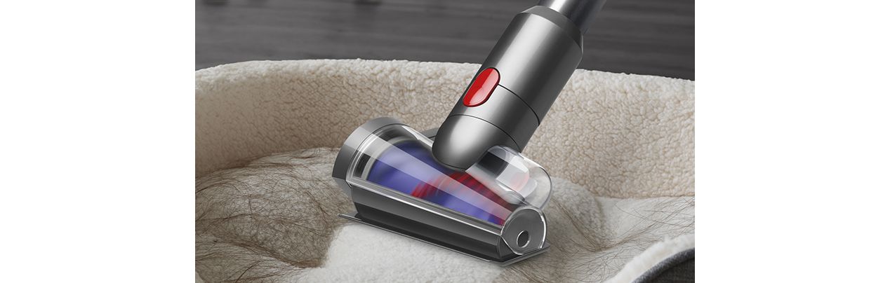 Hair screw tool cleaning a pet bed