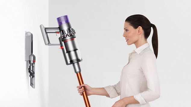 Dyson Cyclone V10 being placed onto docking station