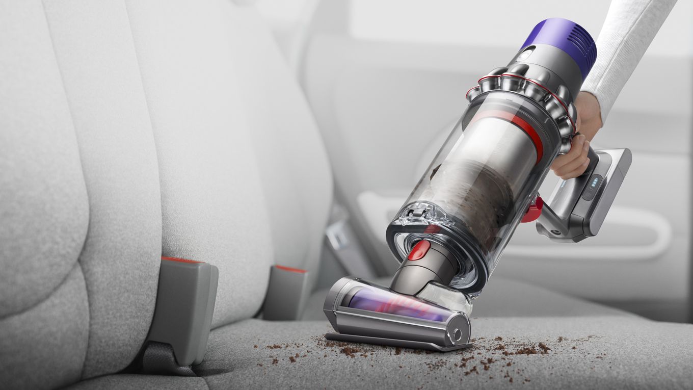 dyson-cyclone-v10-vacuum-handheld-car-interior V10 as a handheld being used to clean car interior