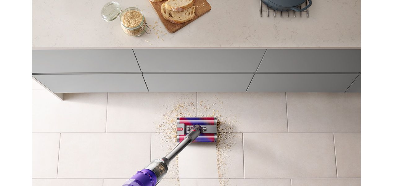Dyson Omni-glide cleaning up mess in kitchen