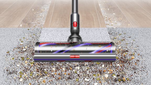 The Dyson Outsize+ vacuum cleaning a carpet