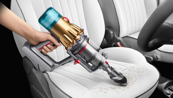 Dyson V12 Detect Slim vacuum cleaning car seat