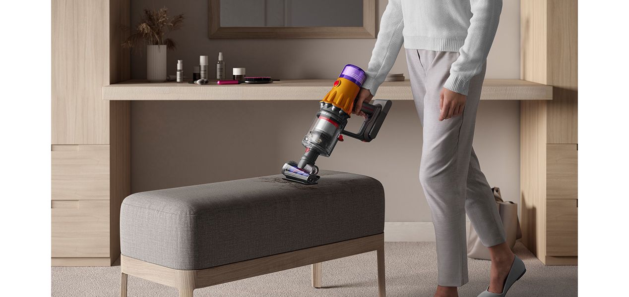 Dyson Hair screw tool sucking up hair from furniture