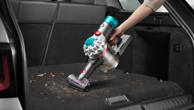 Hair screw tool cleaning a car interior