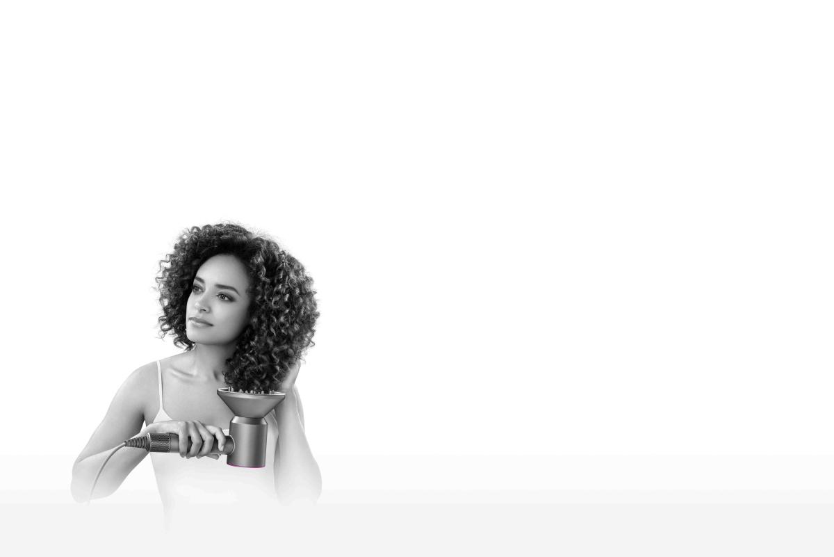 Model with Dyson Supersonic™ hair dryer