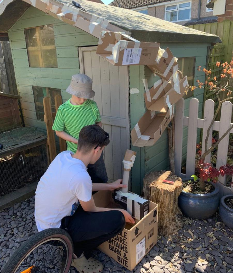 Two young engineers put their final preparations together for the marble run.