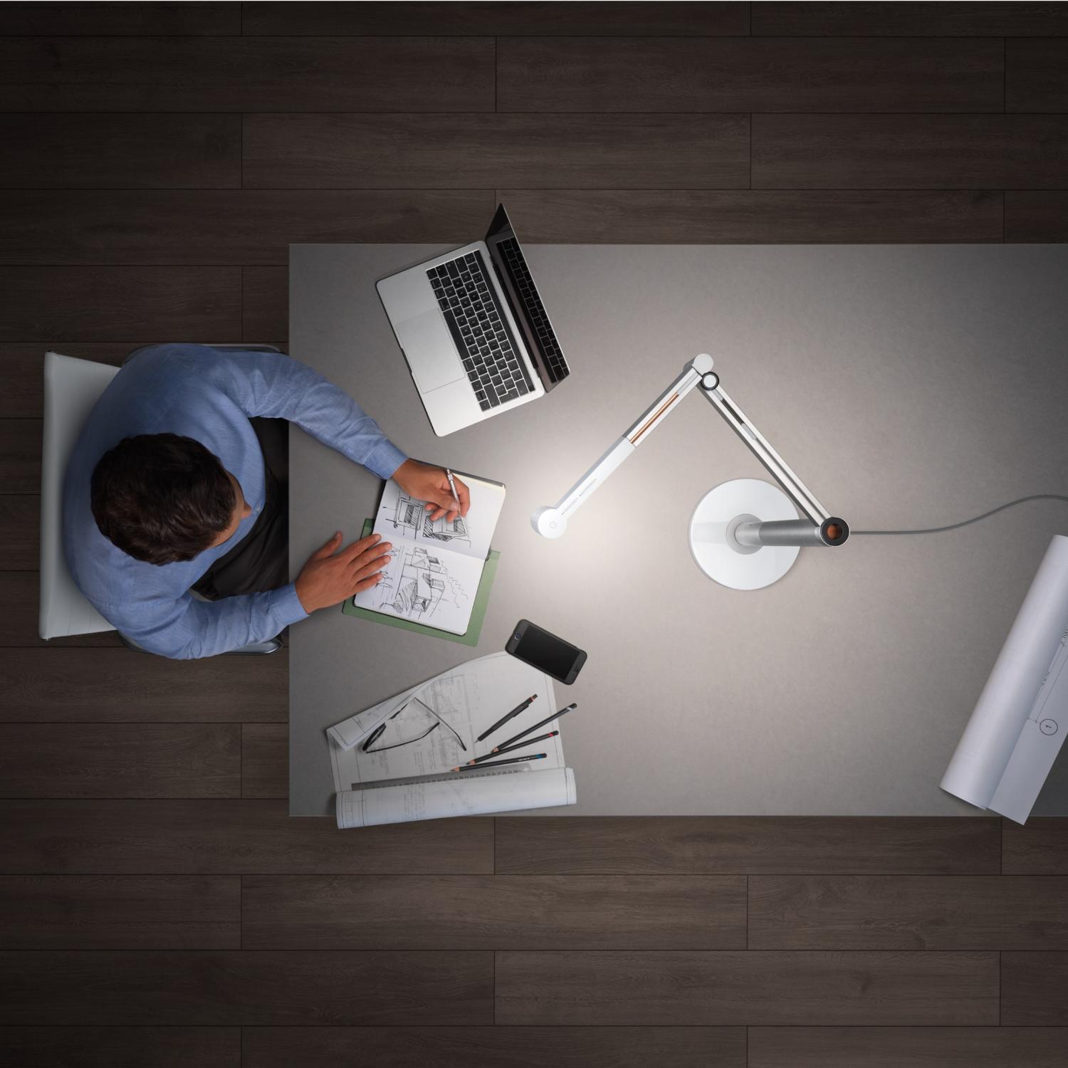 Child working efficiently using Dyson lighting.