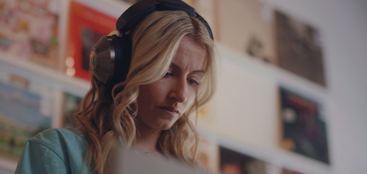 Leah Williamson leaving a record store wearing the Dyson Zone headphones